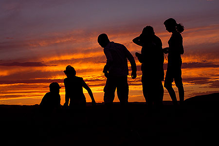 People at sunset at Horseshoe Bend of the Colorado River 