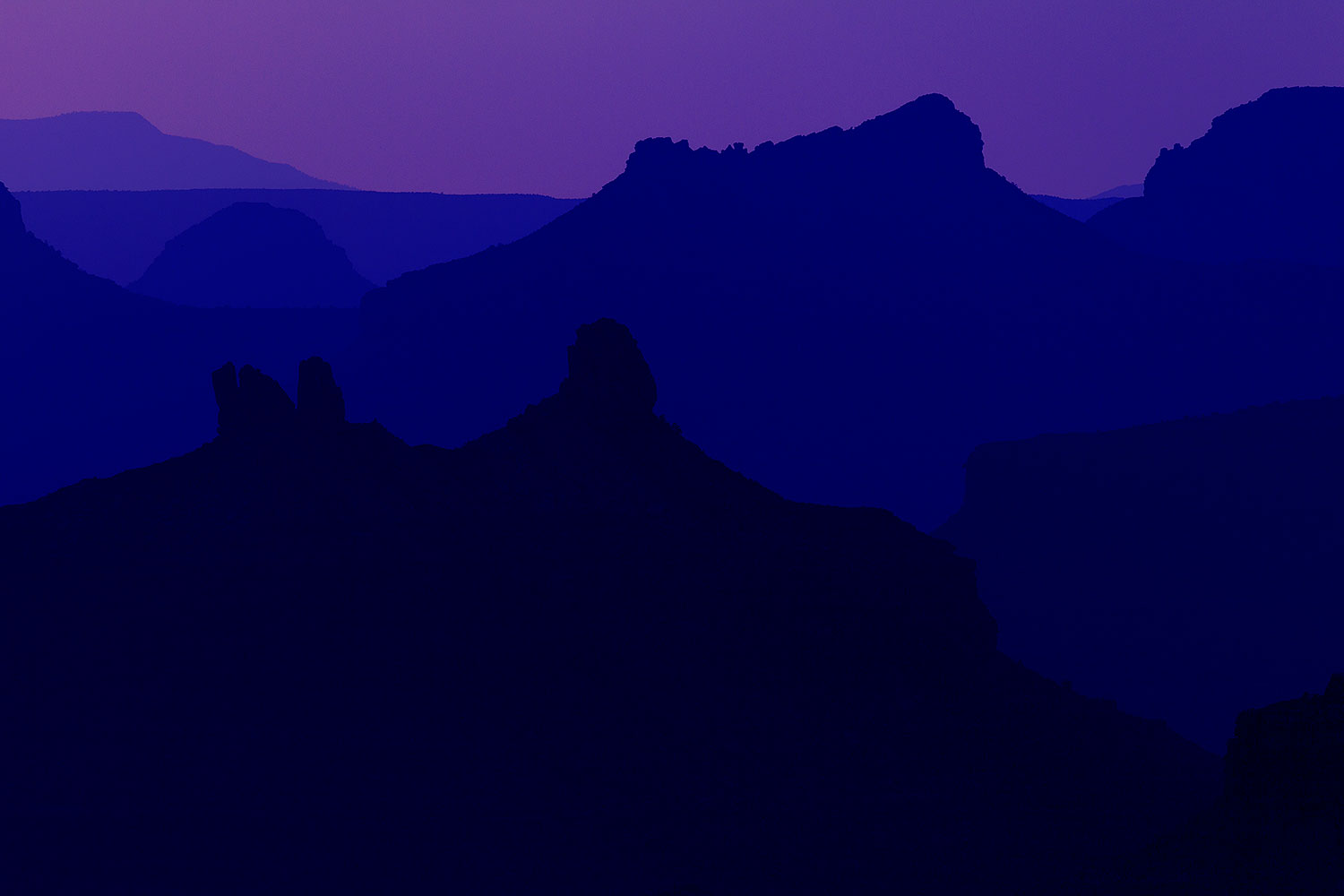 Mountain silhouettes at sunset in Grand Canyon â€¦ August 2010