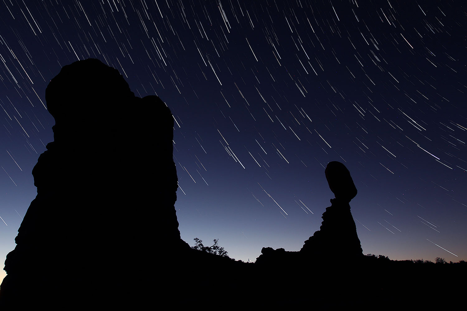 22 minutes of star trails at Balanced Rock in Arches National Park at sunrise â€¦ November 2013