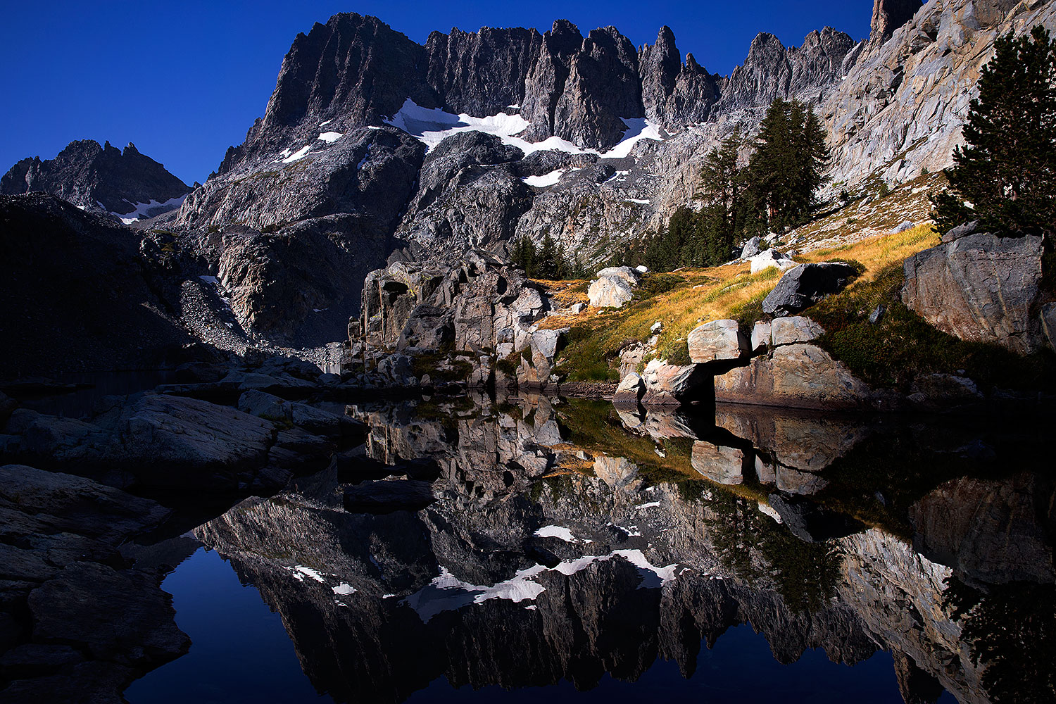 Minarets reflecting in Iceberg Lake in Eastern Sierra, California â€¦ September 2016
